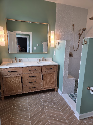 Finished green bathroom with custom vanity and shower